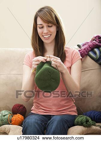 Young woman knitting woolly hat View Large Photo Image Picture - Young woman knitting woolly hat. Fotosearch
