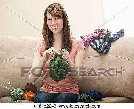 Young woman knitting woolly hat View Large Photo Image Stock Image - Young woman knitting woolly hat. Fotosearch