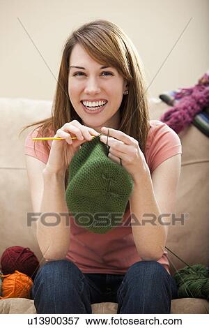 Young woman knitting woolly hat View Large Photo Image Stock Photo - Young woman knitting woolly hat. Fotosearch