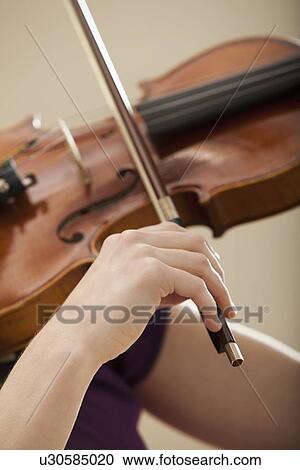 Young woman playing violin View Large Photo Image Stock Image - Young woman playing violin. Fotosearch