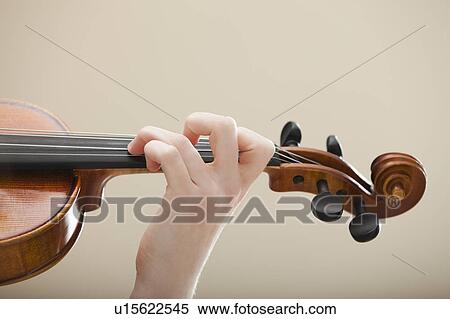 Stock Photography - Young woman playing violin. Fotosearch