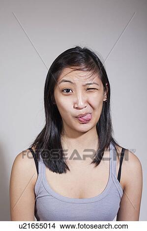 Young woman sticking out tongue View Large Photo Image Picture - Young woman sticking out tongue. Fotosearch