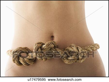 Stock Photography - Young woman with knots in stomach. Fotosearch
