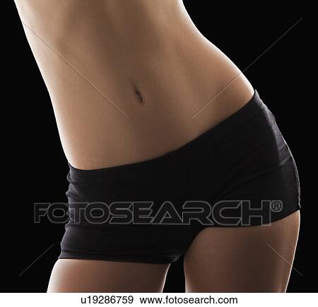 Stock Photo - Young woman with slim belly. Fotosearch