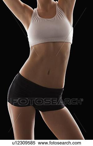 Stock Photography - Young woman with slim belly. Fotosearch
