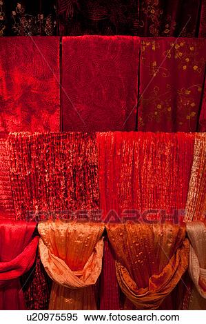 Red velvet and silk scarves hanging in four rows, window display, Venice, Northern Italy View Large Photo Image Stock Photography - Red velvet and silk scarves hanging in four rows, window display, Venice, Northern Italy. Fotosearch