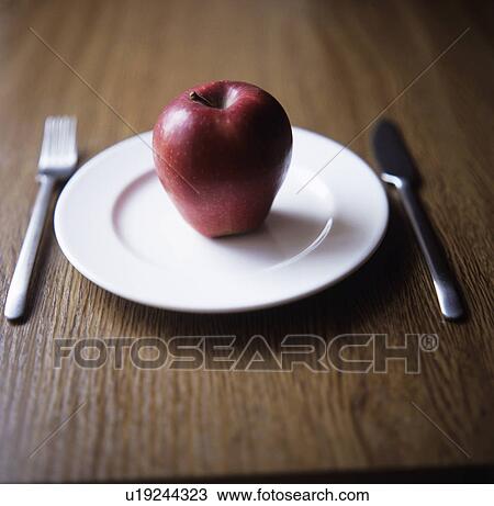 Apple on plate View Large Photo Image Stock Image - Apple on plate. Fotosearch