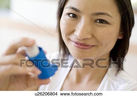 Asthma inhaler use View Large Photo Image Picture - Asthma inhaler use. Fotosearch