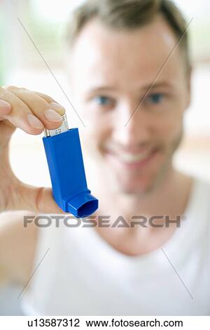 Asthma inhaler use View Large Photo Image Stock Image - Asthma inhaler use. Fotosearch