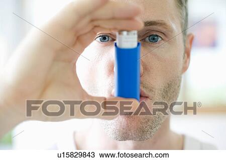 Asthma inhaler use View Large Photo Image Stock Image - Asthma inhaler use. Fotosearch