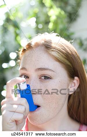 Asthma inhaler use View Large Photo Image Stock Photo - Asthma inhaler use. Fotosearch
