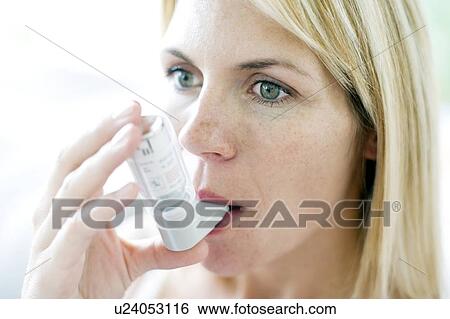 Stock Photograph - Asthma inhaler use. Fotosearch