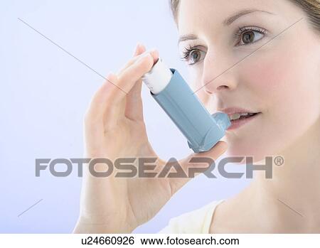 Asthma inhaler use View Large Photo Image Stock Photograph - Asthma inhaler use. Fotosearch