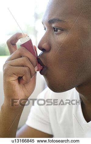 Stock Photography - Asthma inhaler use. Fotosearch