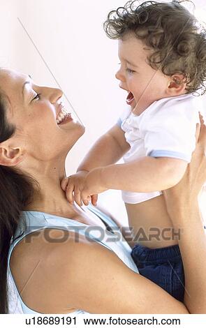 Stock Image - Baby boy and mother. Fotosearch