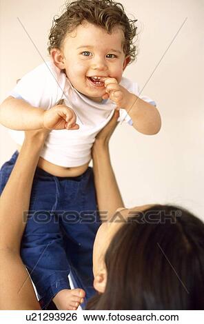 Baby boy and mother View Large Photo Image Stock Photograph - Baby boy and mother. Fotosearch