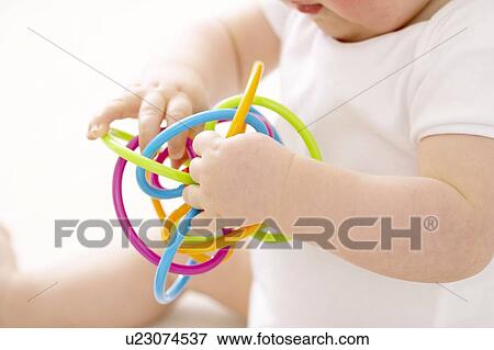 Baby boy playing View Large Photo Image Stock Photo - Baby boy playing. Fotosearch