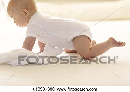 Stock Image - Baby crawling. Fotosearch