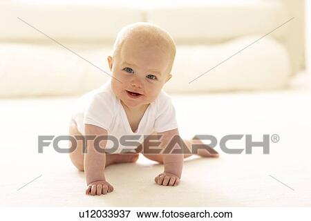 Stock Photo - Baby crawling. Fotosearch