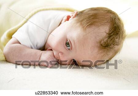 Baby girl sucking her thumb View Large Photo Image Stock Image - Baby girl sucking her thumb. Fotosearch