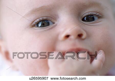 Baby girl's face View Large Photo Image Stock Photo - Baby girl's face. Fotosearch