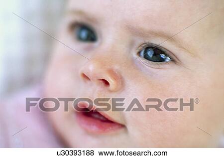 Baby girl's face View Large Photo Image Stock Photo - Baby girl's face. Fotosearch