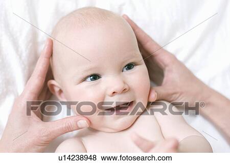 Stock Photo - Baby massage. Fotosearch