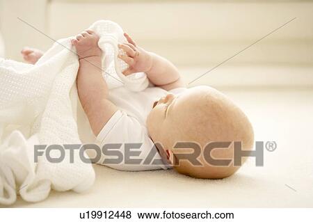 Baby playing View Large Photo Image Stock Photo - Baby playing. Fotosearch