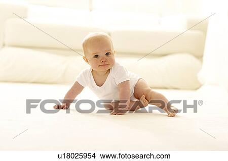 Baby sitting on a carpet View Large Photo Image Picture - Baby sitting on a carpet. Fotosearch