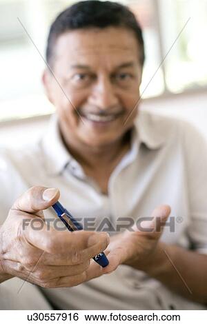 Blood glucose test View Large Photo Image Stock Photograph - Blood glucose test. Fotosearch