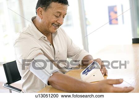 Stock Image - Blood pressure measurement. Fotosearch