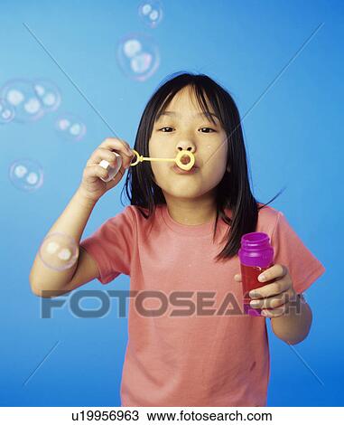 Blowing bubbles View Large Photo Image Stock Image - Blowing bubbles. Fotosearch