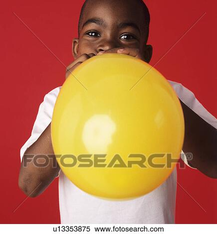 Blowing up a balloon View Large Photo Image Stock Photography - Blowing up a balloon. Fotosearch