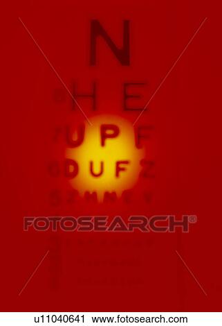 Stock Image - Blurred view of a Snellen eye test chart. Fotosearch