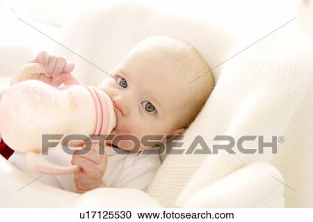 Stock Image - Bottle feeding. Fotosearch