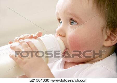 Stock Image - Bottle feeding. Fotosearch