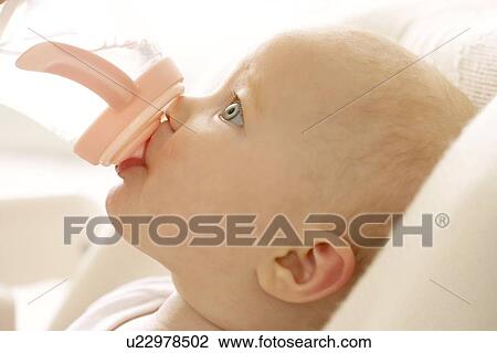 Bottle feeding View Large Photo Image Stock Image - Bottle feeding. Fotosearch