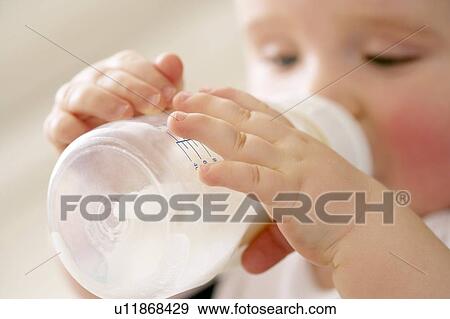 Stock Photo - Bottle feeding. Fotosearch