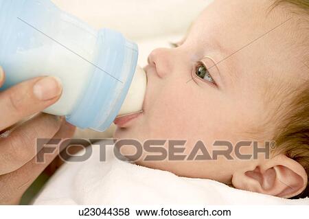 Stock Photo - Bottle feeding. Fotosearch