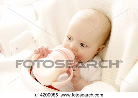Stock Photography - Bottle feeding. Fotosearch