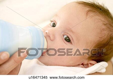 Stock Photography - Bottle feeding. Fotosearch