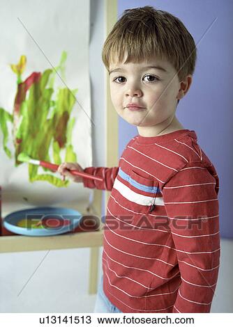 Boy painting View Large Photo Image Stock Image - Boy painting. Fotosearch