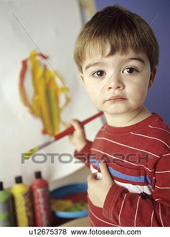 Boy painting View Large Photo Image Stock Photo - Boy painting. Fotosearch