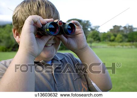 Boy using binoculars View Large Photo Image Stock Image - Boy using binoculars. Fotosearch