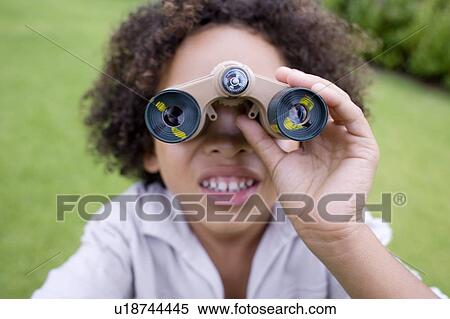 Boy using binoculars View Large Photo Image Stock Photography - Boy using binoculars. Fotosearch