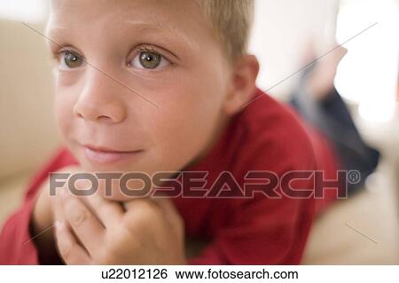 Stock Photograph - Boy watching television. Fotosearch