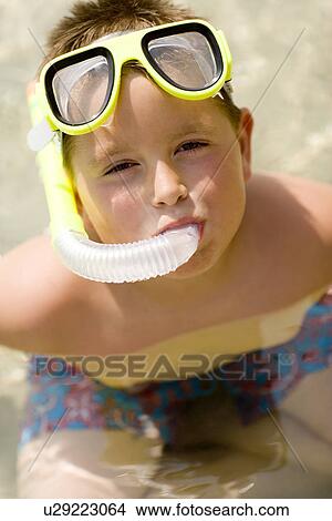 Boy wearing a snorkel View Large Photo Image Picture - Boy wearing a snorkel. Fotosearch