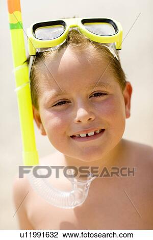 Boy wearing a snorkel View Large Photo Image Stock Image - Boy wearing a snorkel. Fotosearch