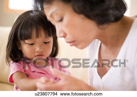 Picture - Checking for rash. Fotosearch