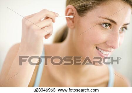Cleaning ears View Large Photo Image Stock Image - Cleaning ears. Fotosearch